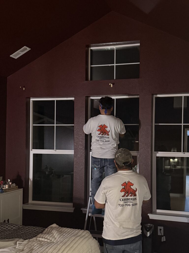Cerberus Home painting crew prepping windows on a vaulted accent wall