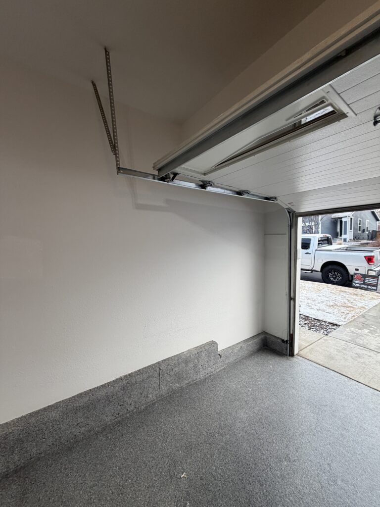 Garage walls after painting by Cerberus Home — finished smooth white walls